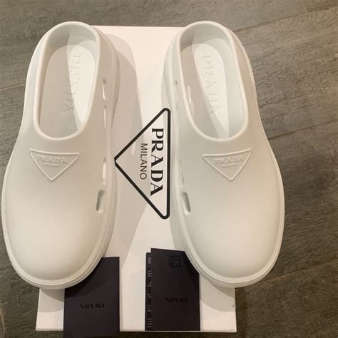 Shop Prada Mellow Molded Logo Mules 